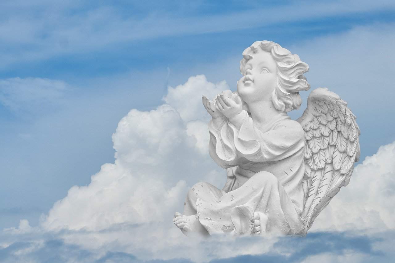 An Angel sculpture looking To The Sky