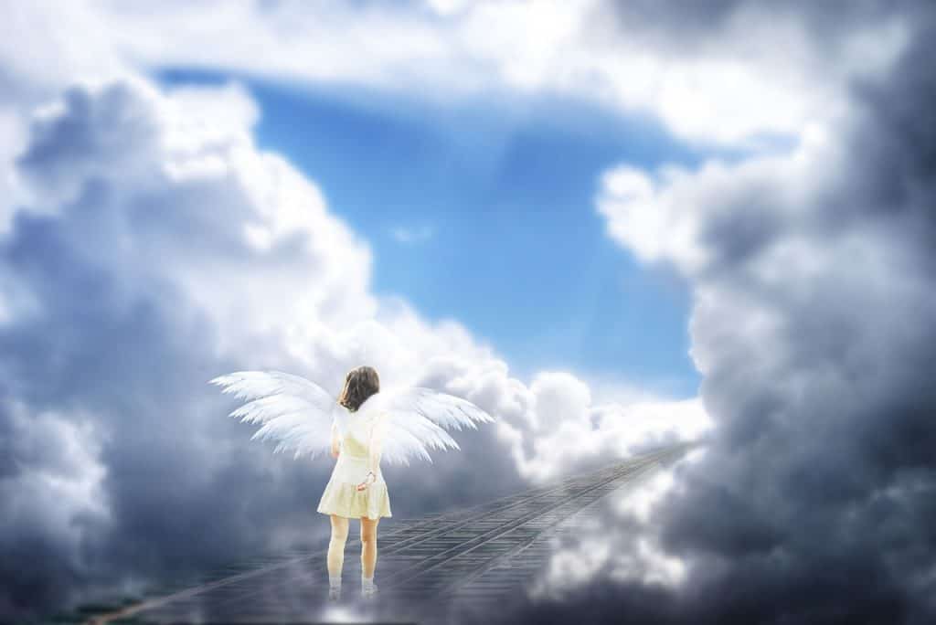 An Angel On The Heaven With Gray And White Clouds