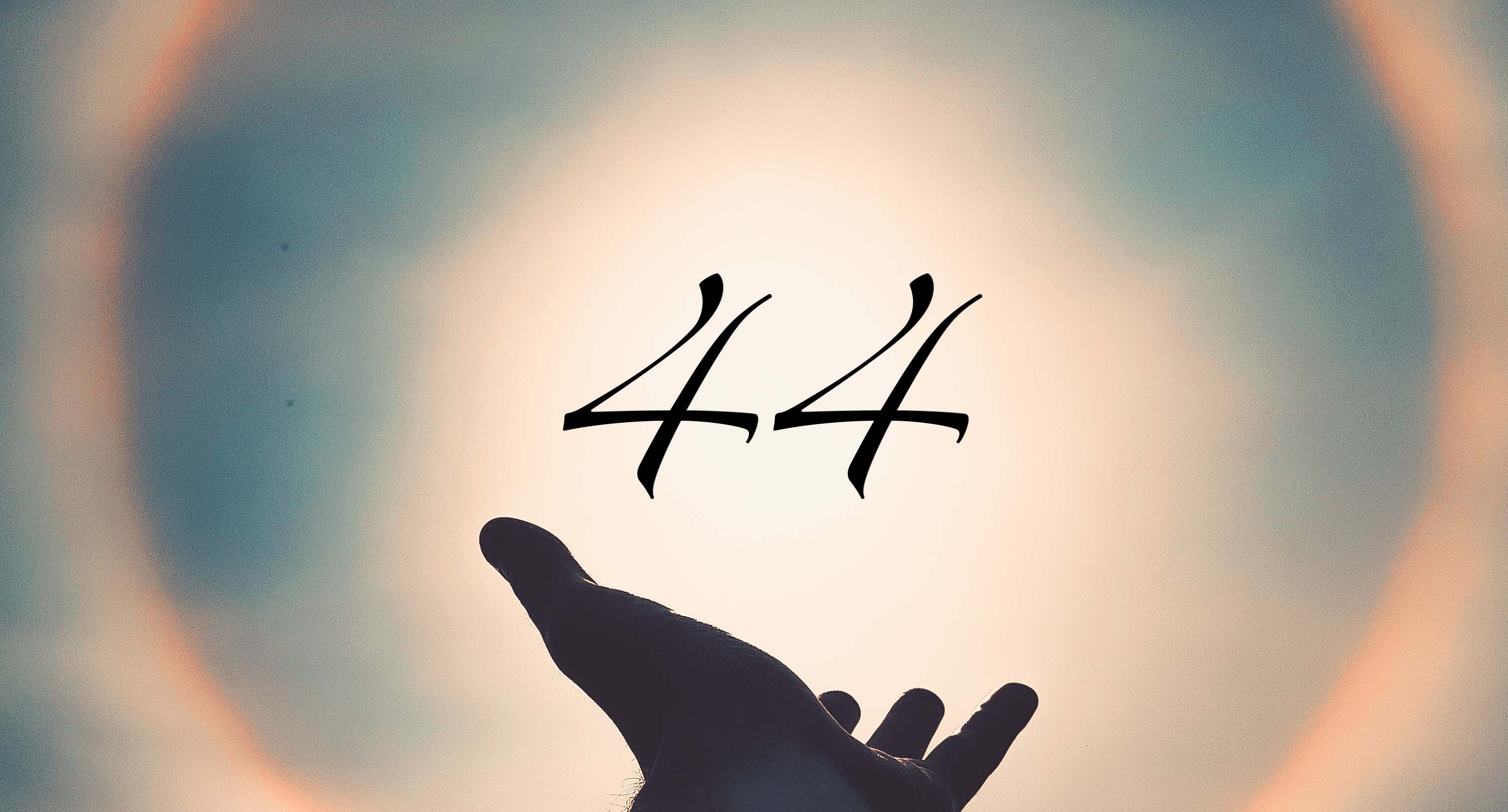 Hand pointing to the sun with number 44 on top of it