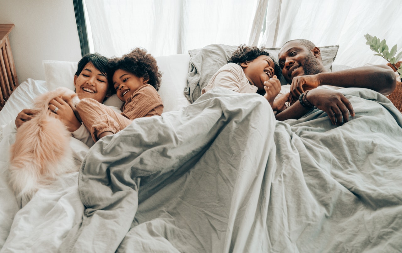 A Happy Family in Bed
