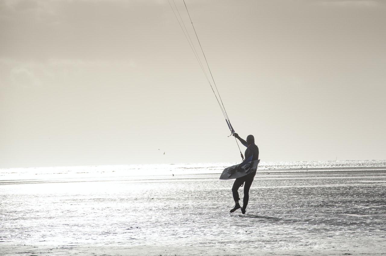 Person With Parachute Strings in the beach