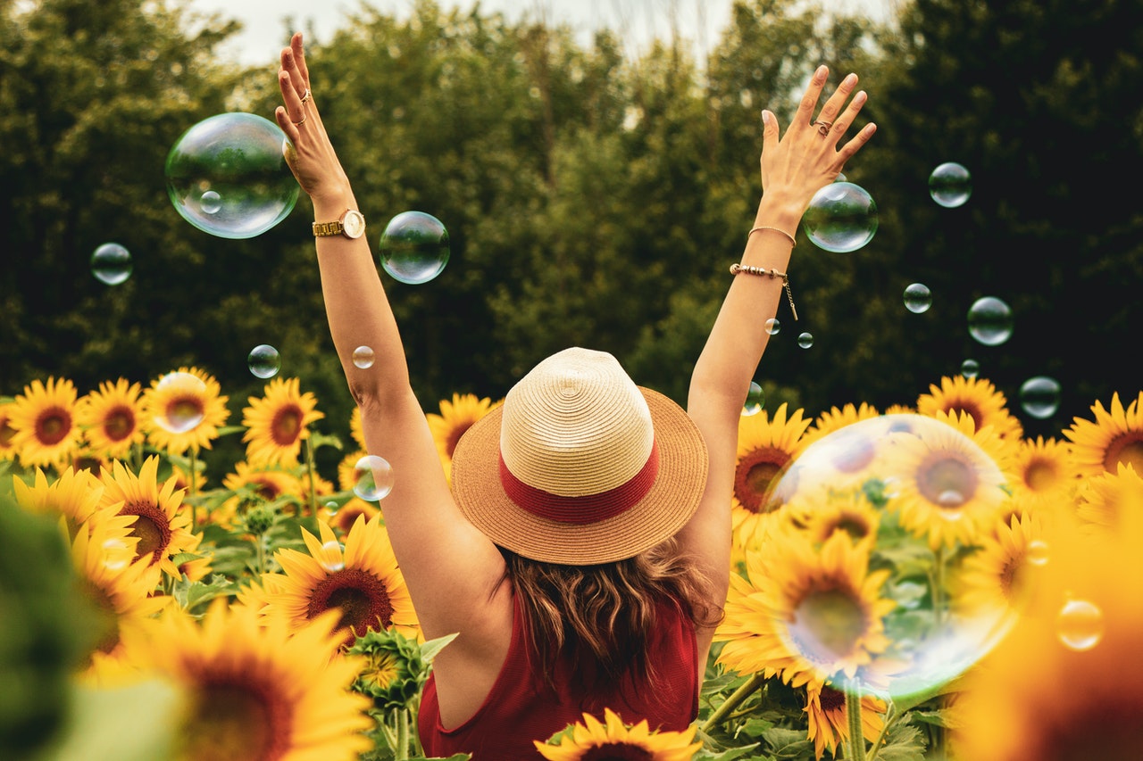 Woman Surrounded By Sunflowers & bubbles