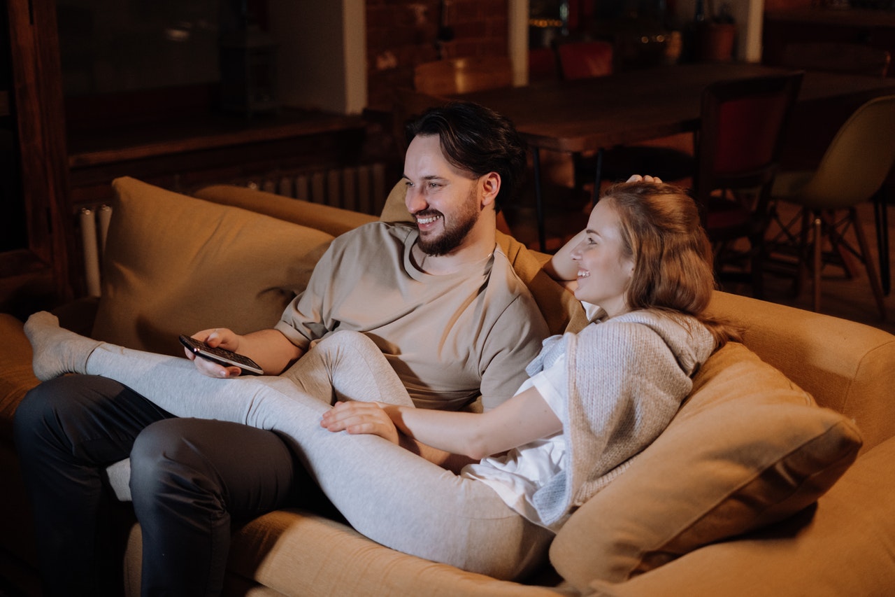 Man and Woman Sitting on Couch.jpg