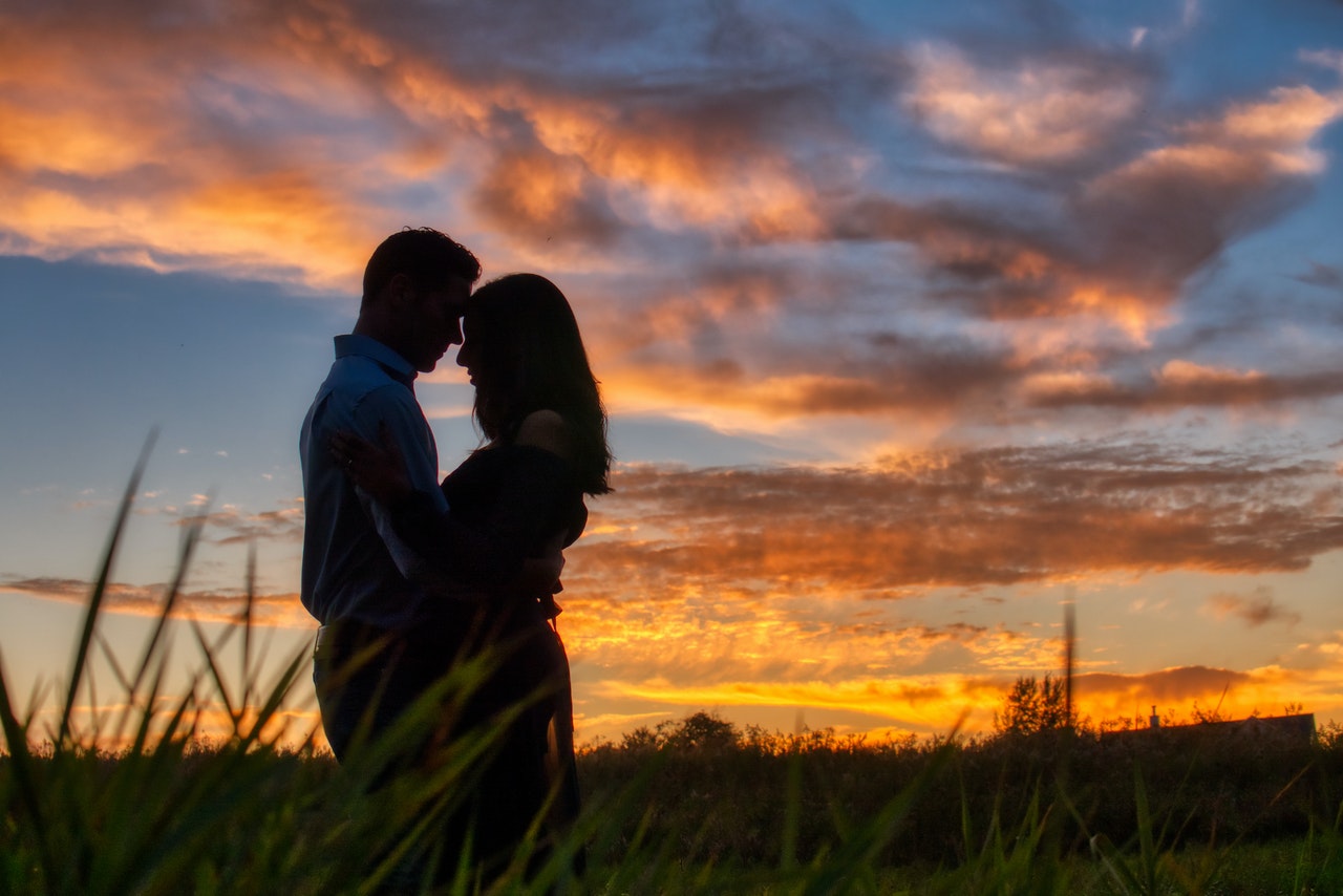 A Couple Enjoying Their Romance during sunset