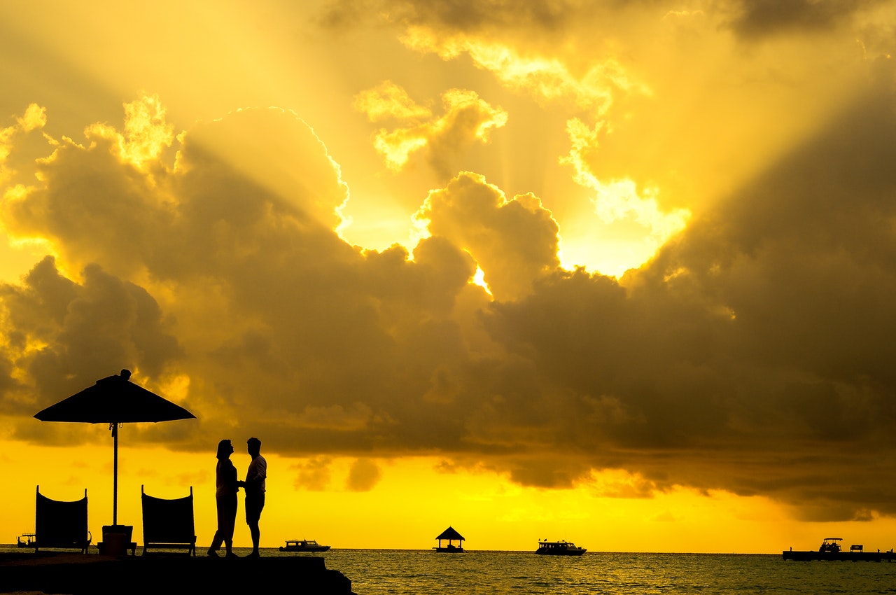  Man and Woman Beside Body of Water during Sunset