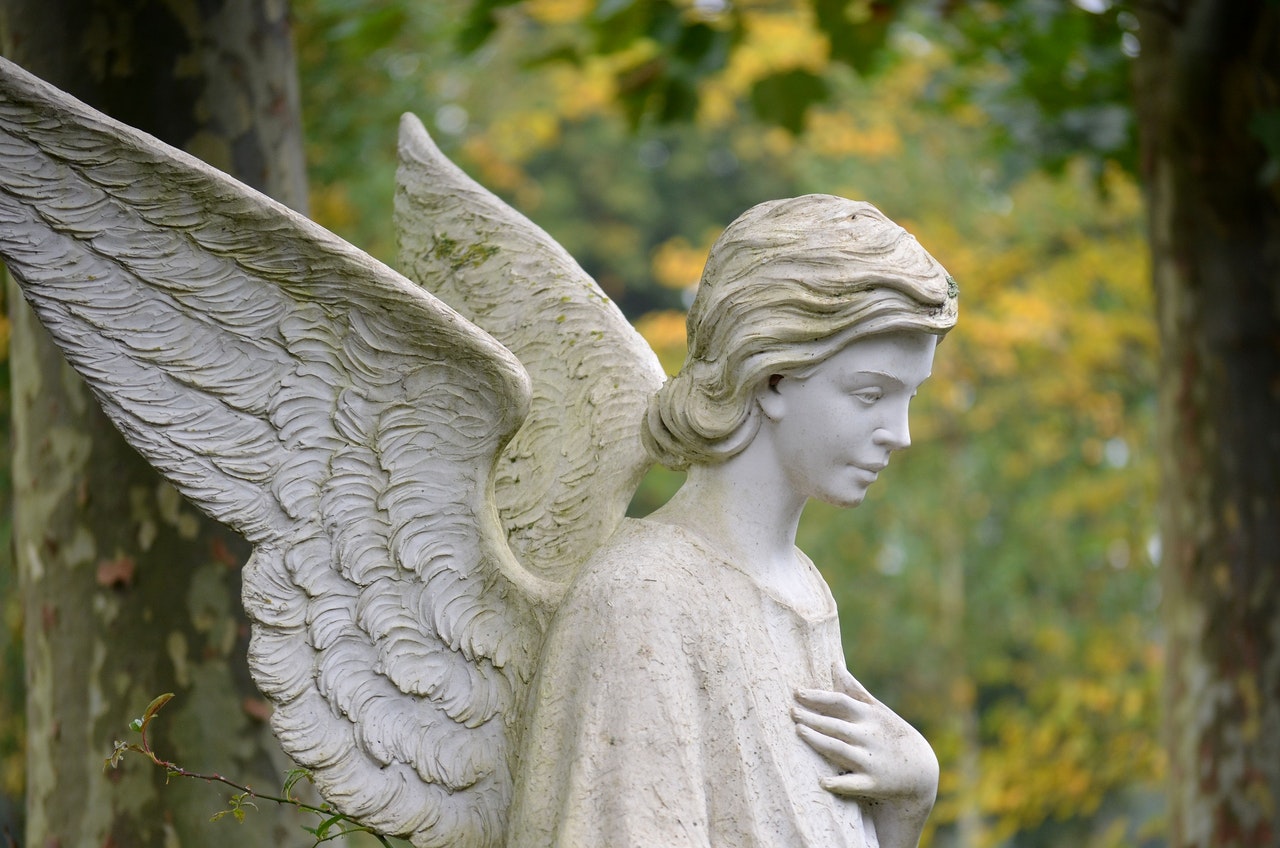 A Statue of a Female Angel with wings