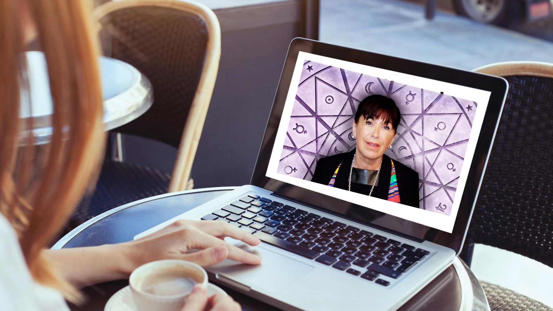 A person using a laptop with psychic esmeralda on the screen