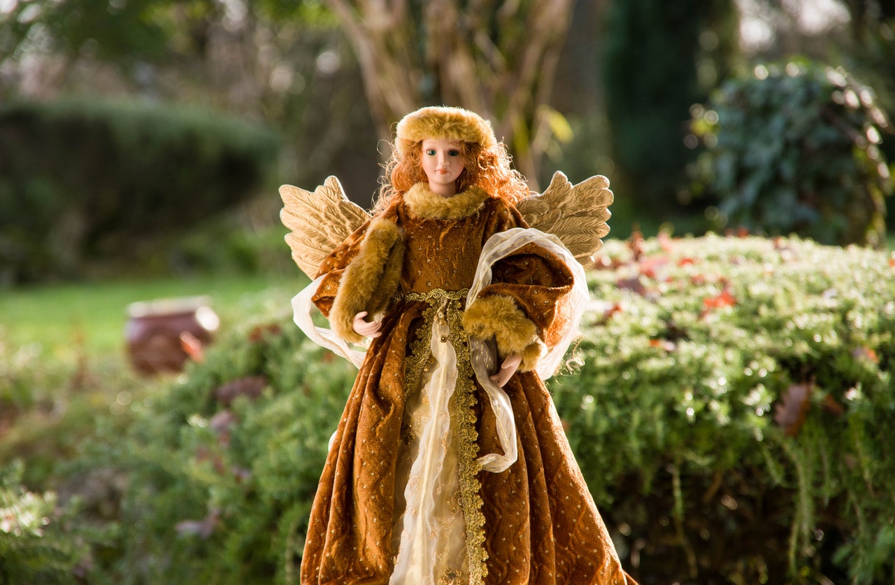 Figurine of an Angel Wearing a Fur Coat