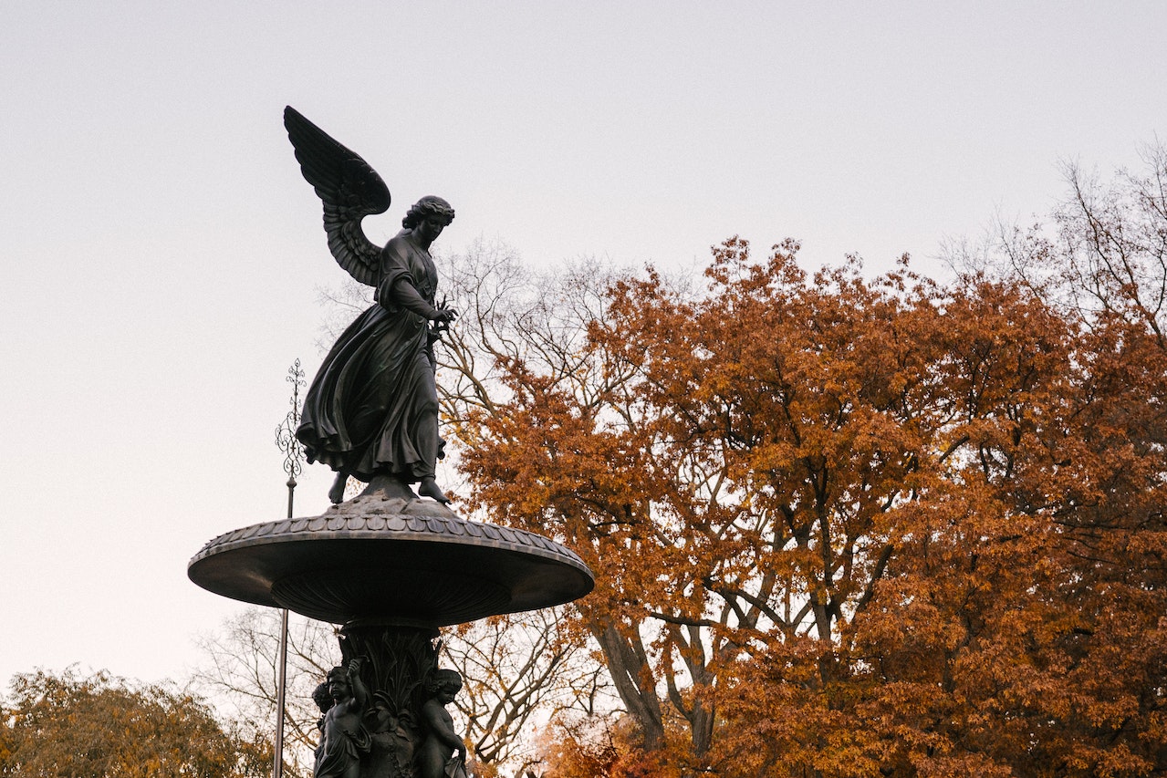 Angel statue and autumn trees