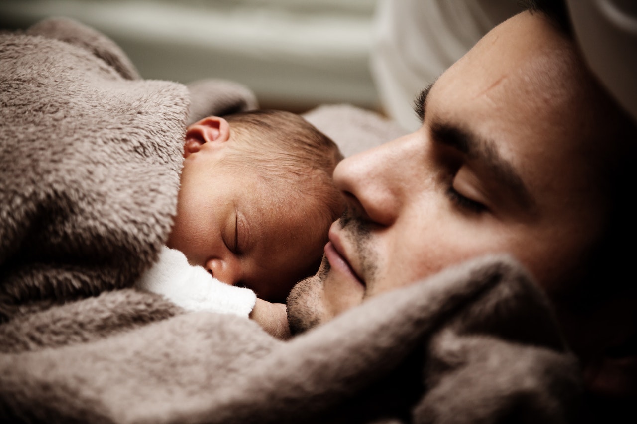 Sleeping Man and Baby On His Chest