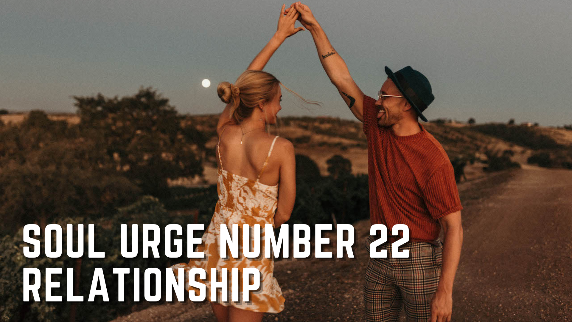 A couple dancing together in the road with words Soul Urge Number 22 Relationships