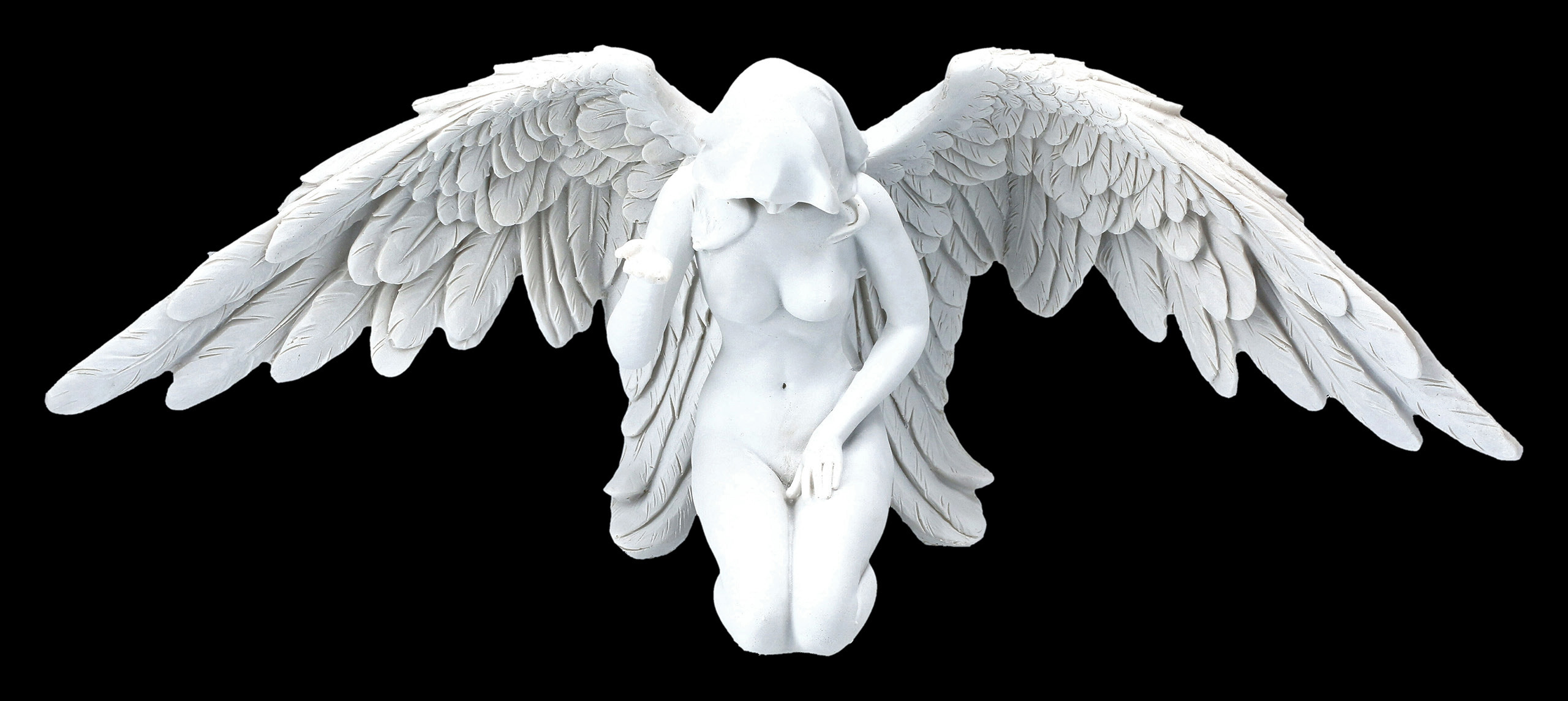 White Angel Figurine Sitting Down On The Black Background