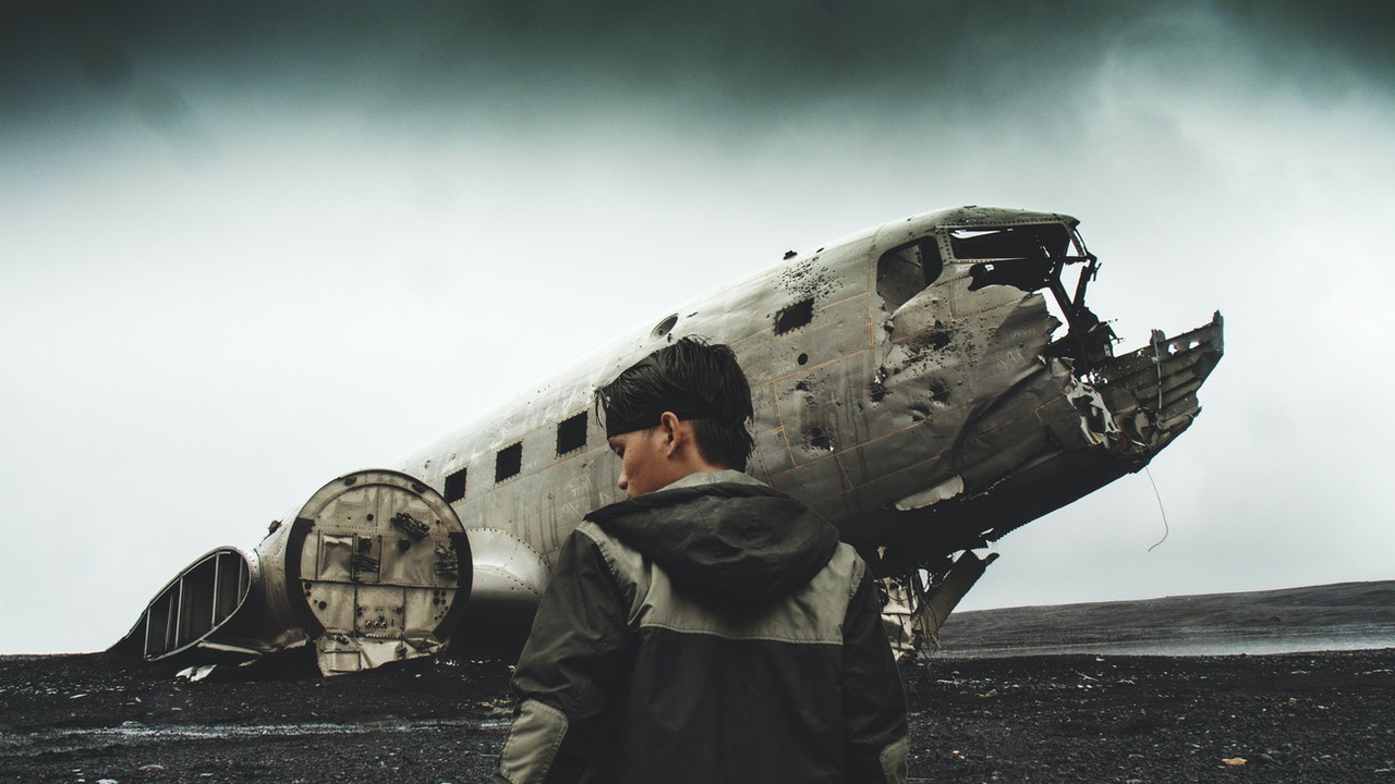 Boy In Front Of Crashed Plane