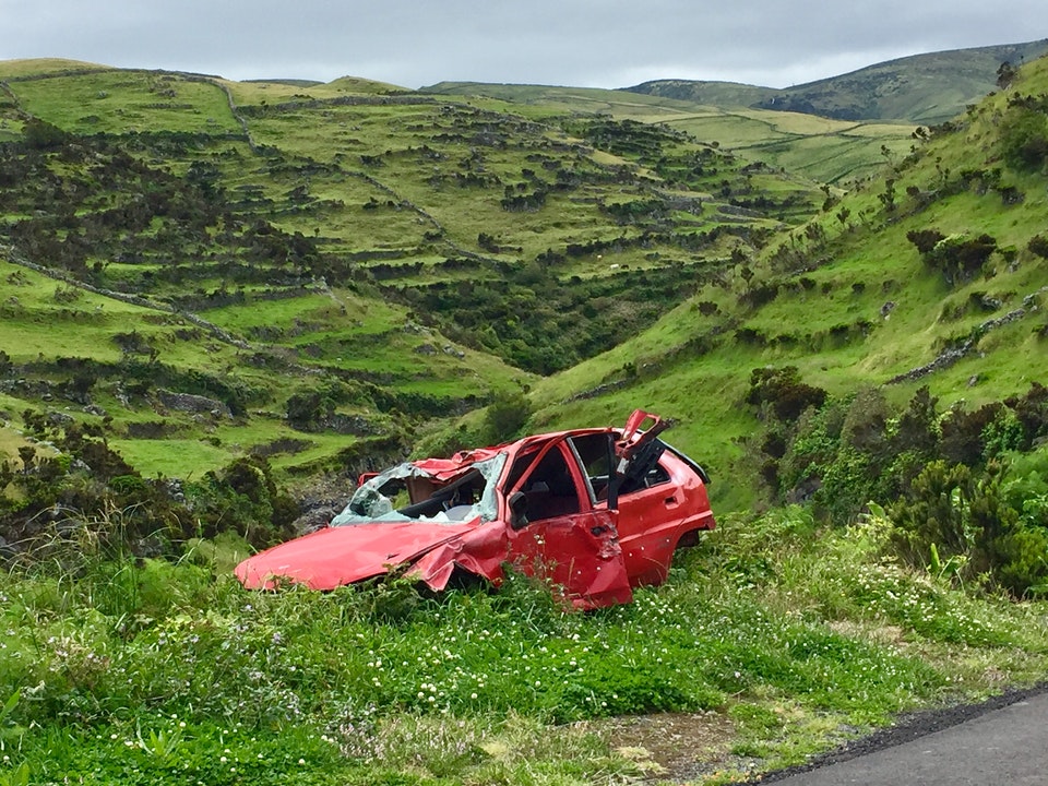 Broken Car In Green Field