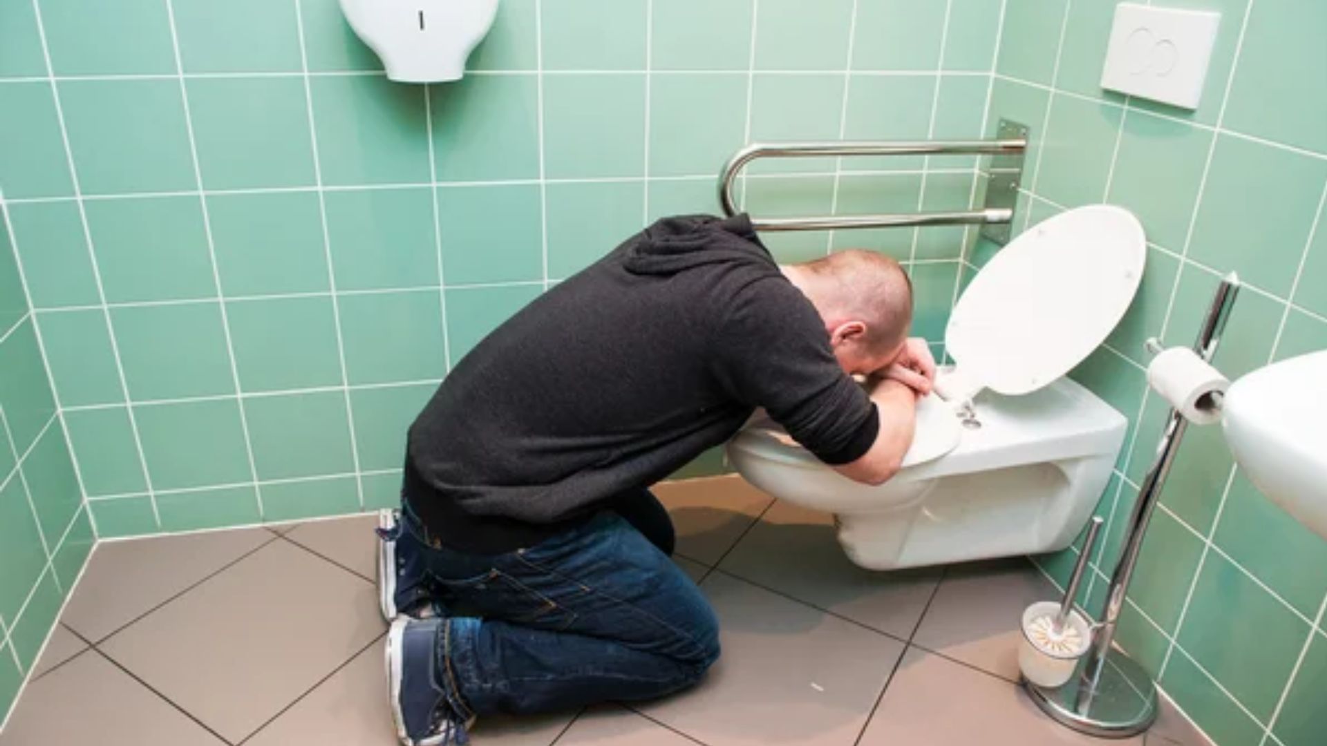 Man On Knees Mouth In Toilet