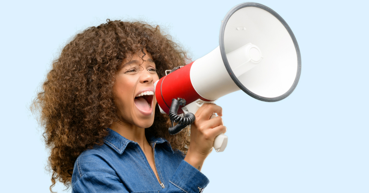 A woman yelling into a megaphone