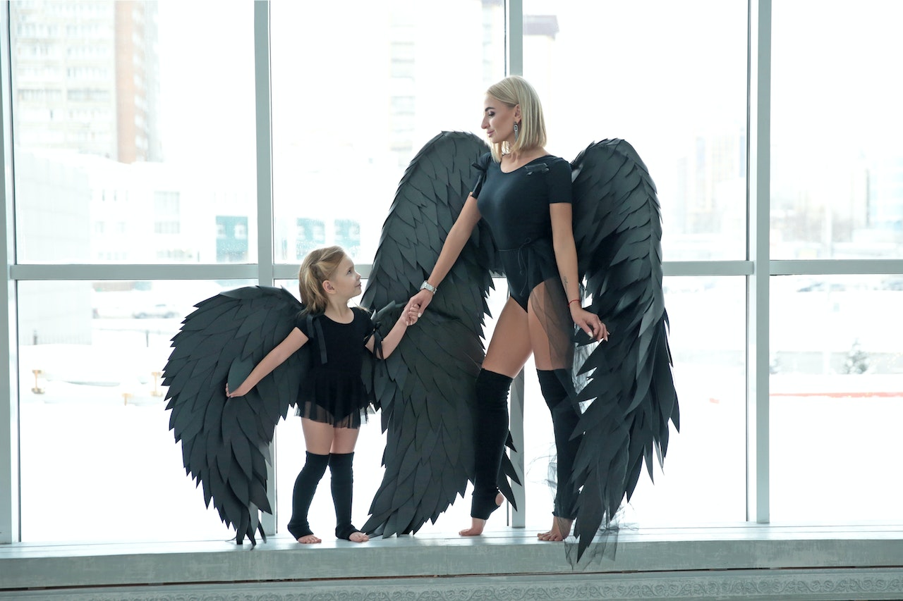 A Mother and Daughter Dressed as Dark Angels