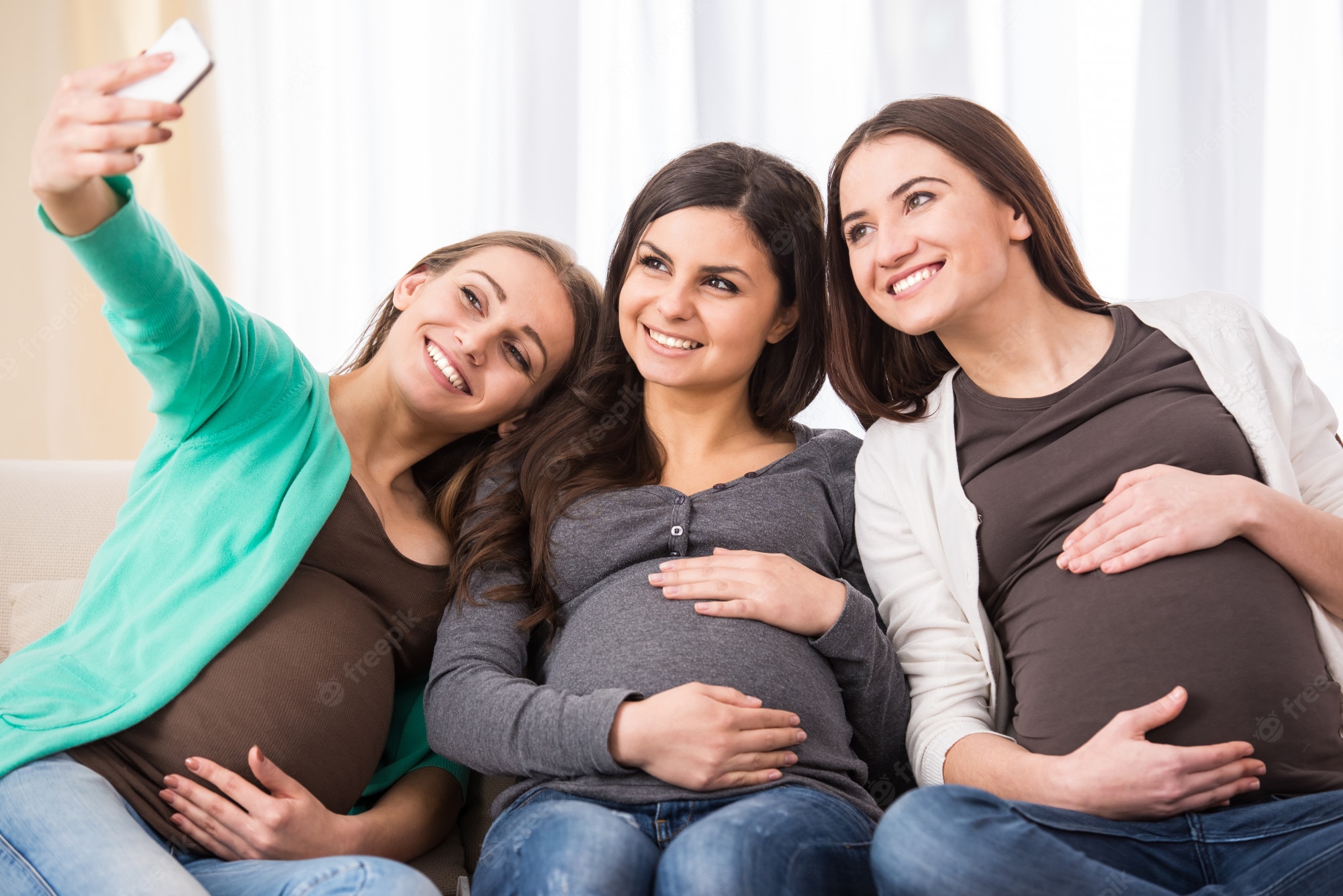 Three pregnant women taking a selfie