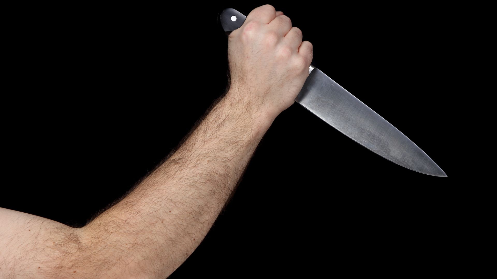 Forearm Of A Person Holding A Knife