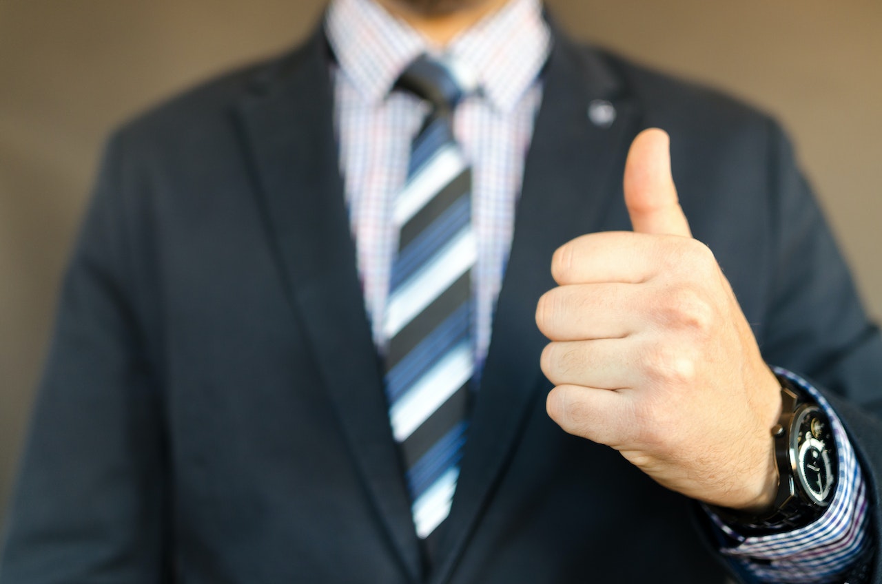 Man In Black Formal Suit Jacket Giving A Thumbs-up