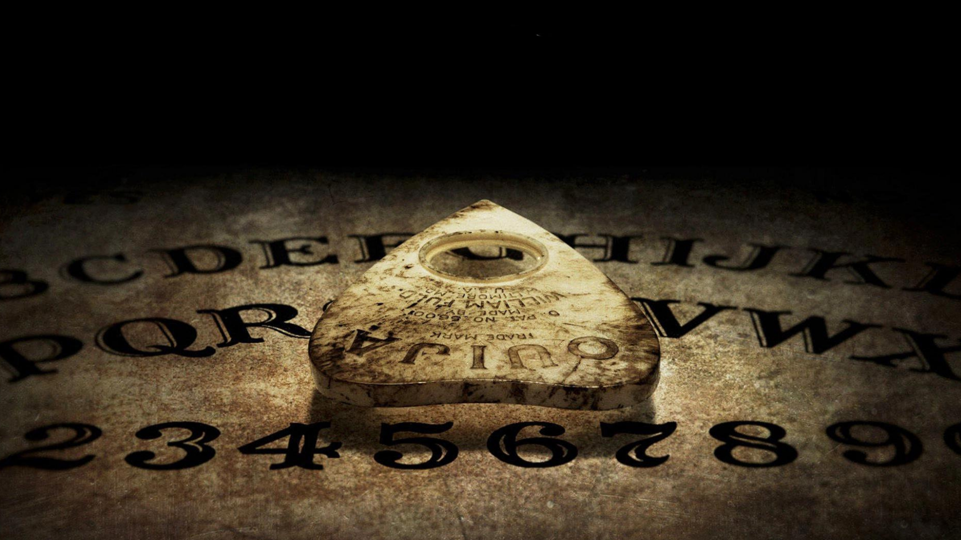Ouija board with written letters and numbers
