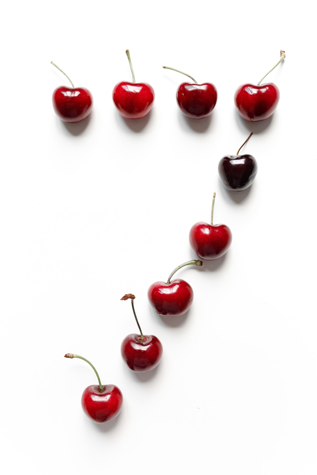 Red Cherries on White Surface