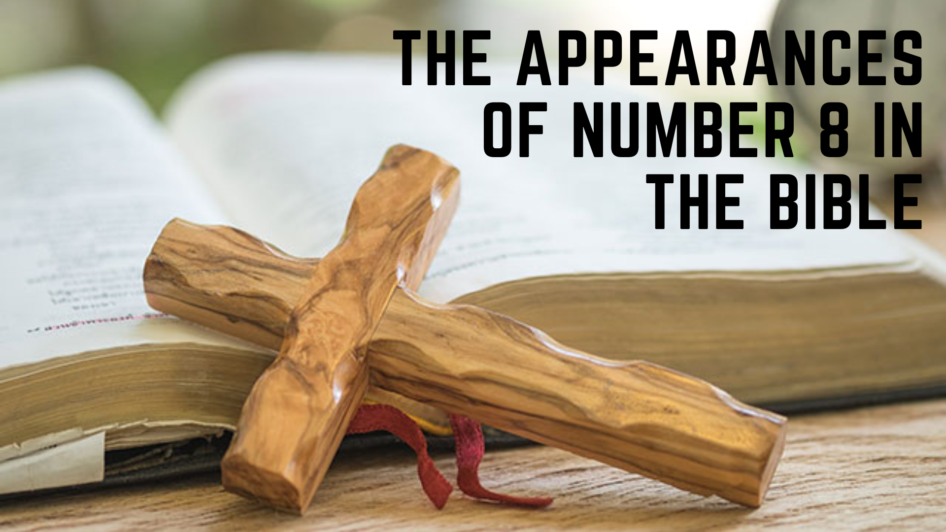 An open Bible with a wooden cross with words The Appearances Of Number 8 In The Bible