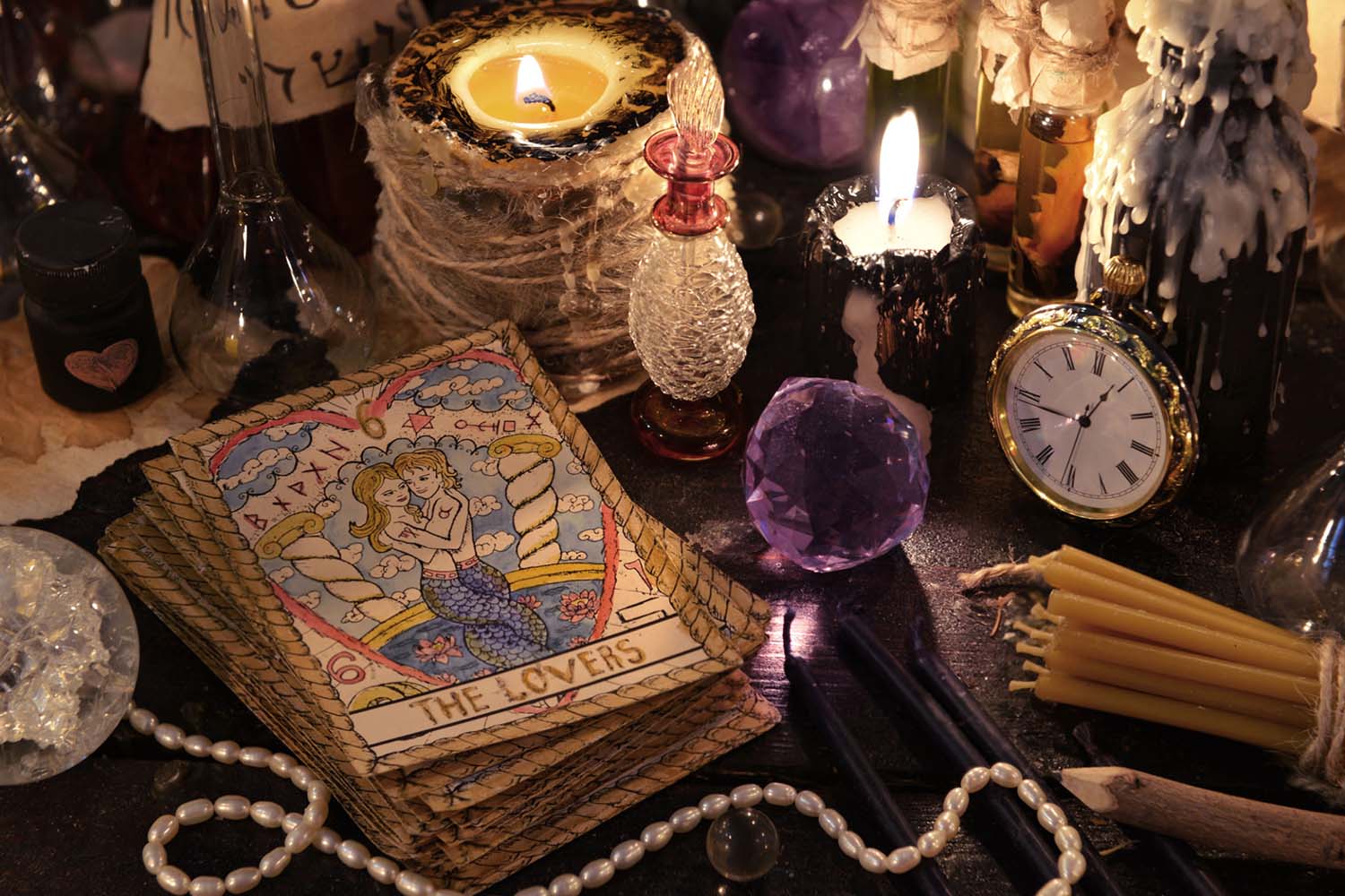 Psychic tools such as tarot cards, candles, pendulum and other ornaments