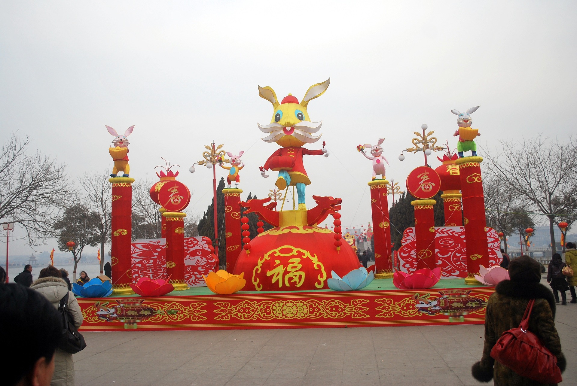 Year of the Rabbit display on the street with a giant rabbit in red Chinese clothes on the center