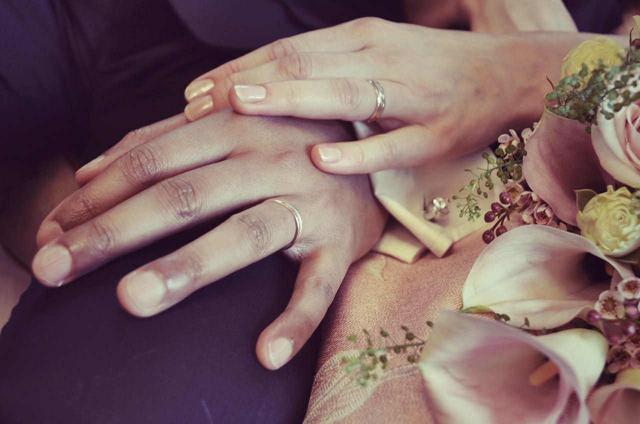 Couple Wearing Silver-colored Ring