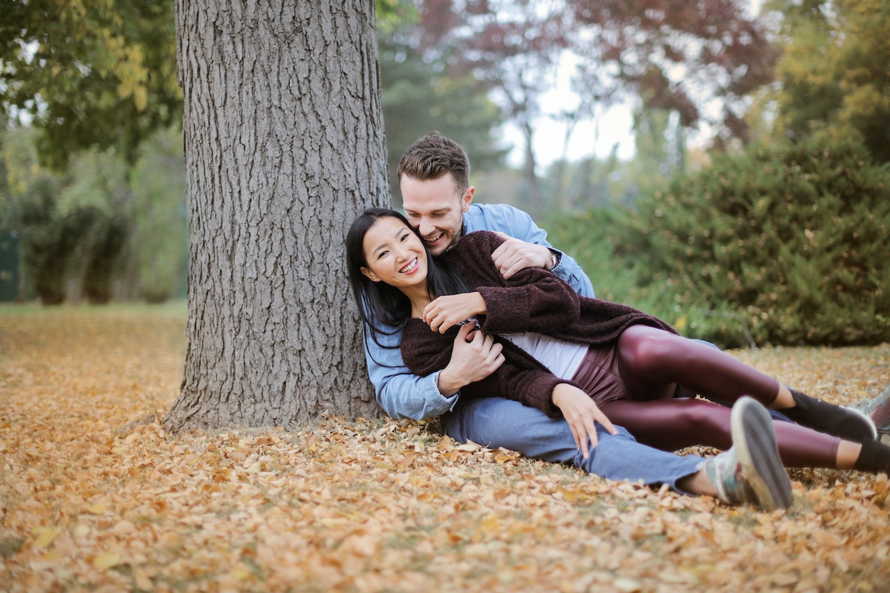 Couple Hugging Under The Tree