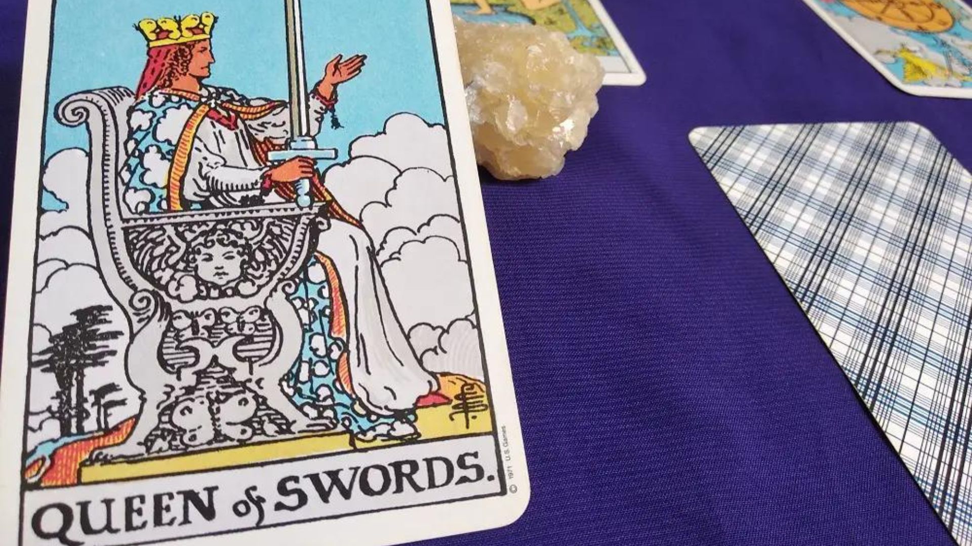 Queen Of Swords Card With Other Cards on A Table