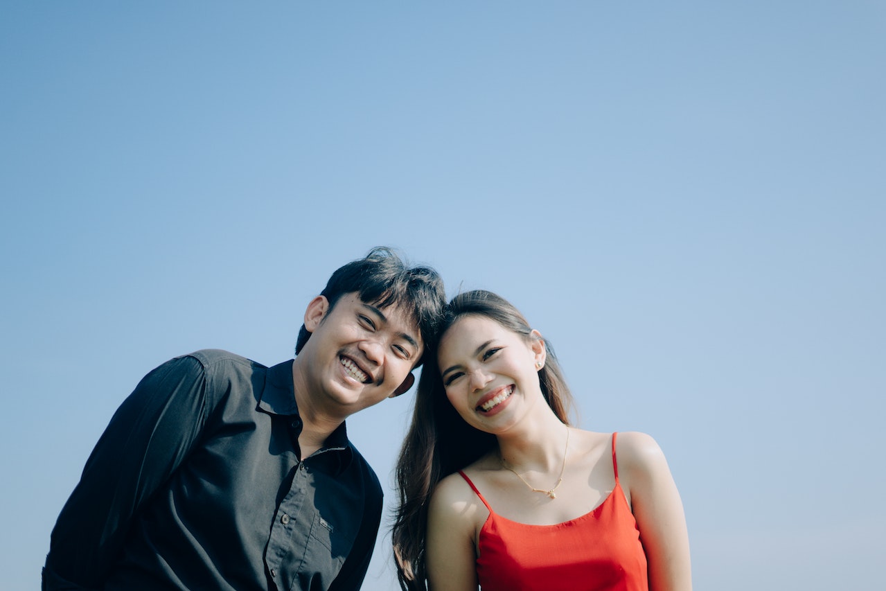 Smiling Couple against Blue Sky