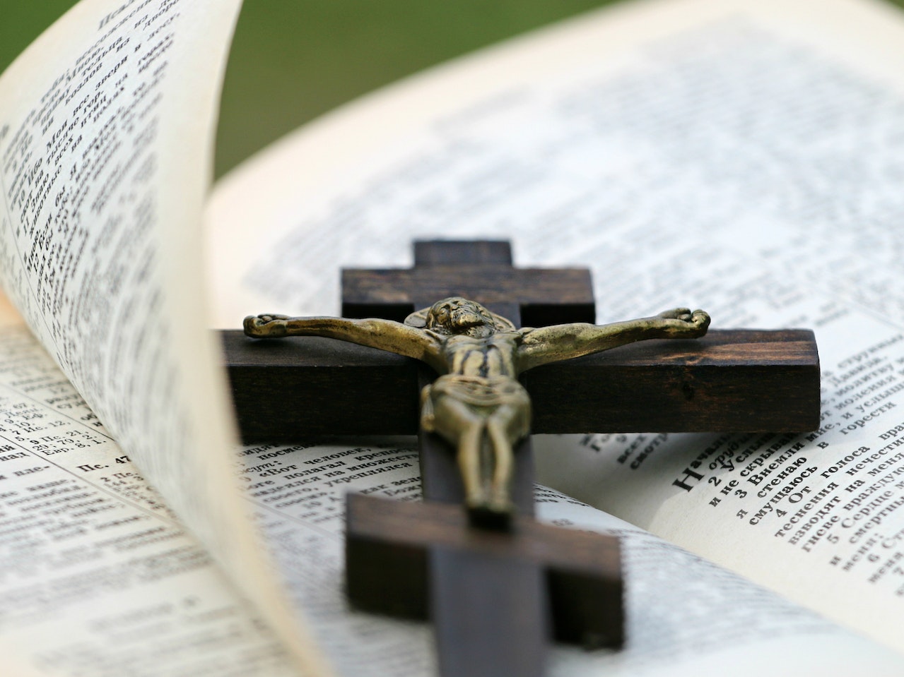 Crucifix on top of an open bible