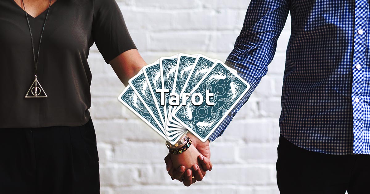 A couple holding hands while standing with words tarot