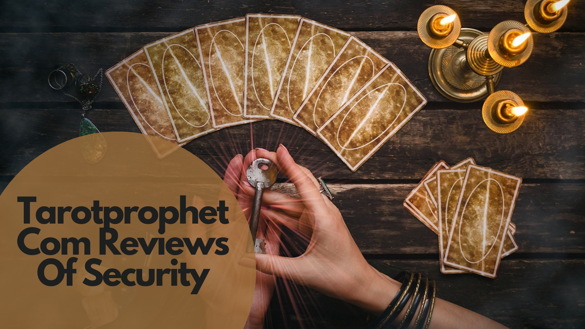 A person holding a key with tarot cards on the table and words Tarotprophet Com Reviews Of Security