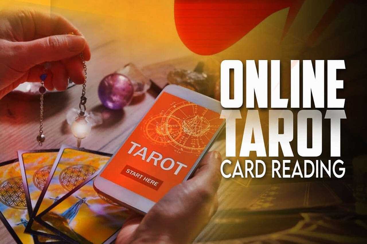 A person holding a phone with "tarot start here" on the screen while holding a pendulum on left hand