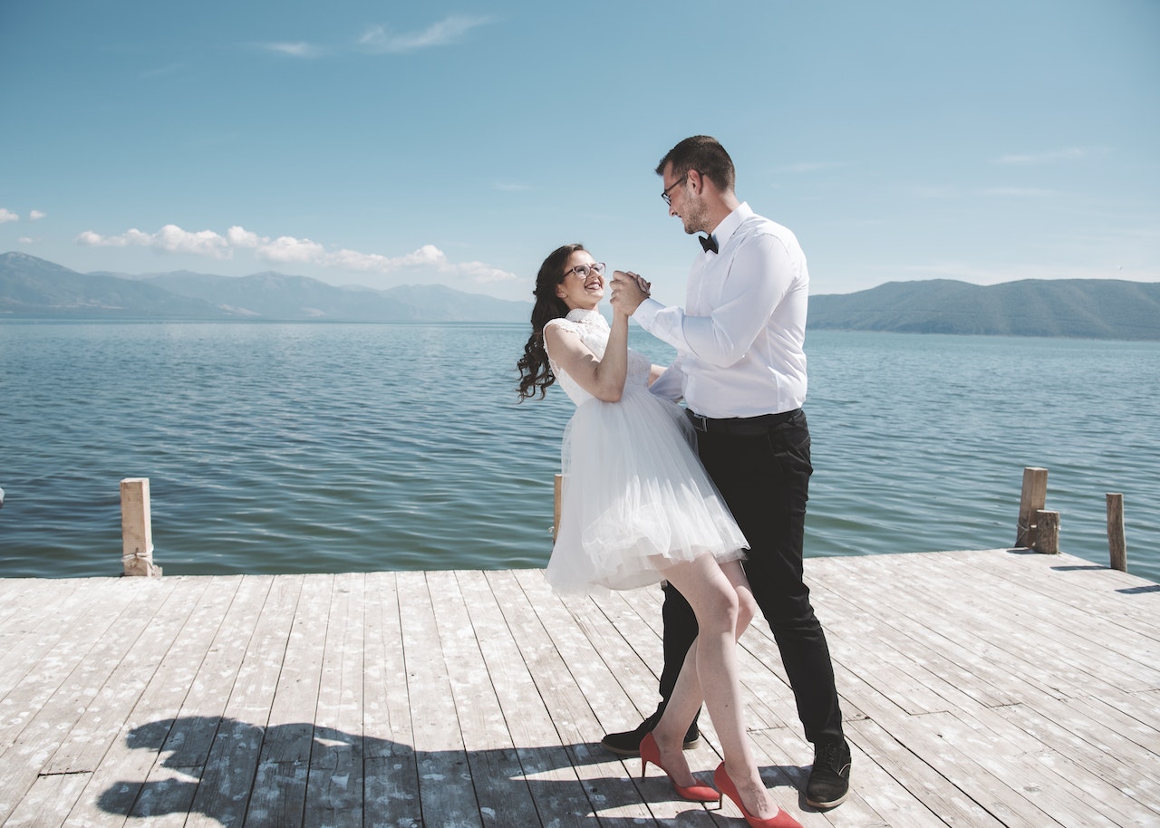 Man and Woman Dancing on a Dock