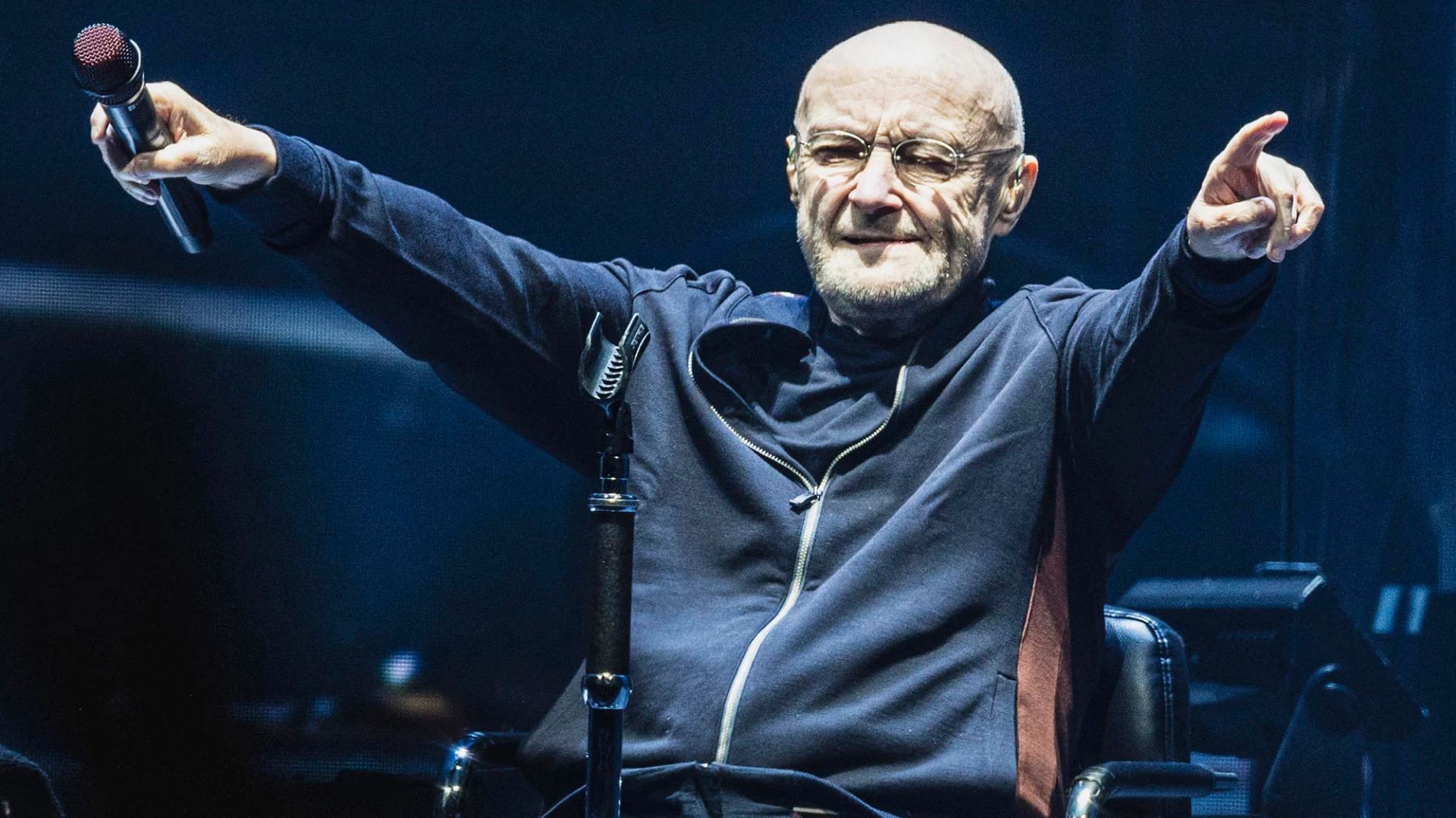 Phil Collins Pointing His Hands