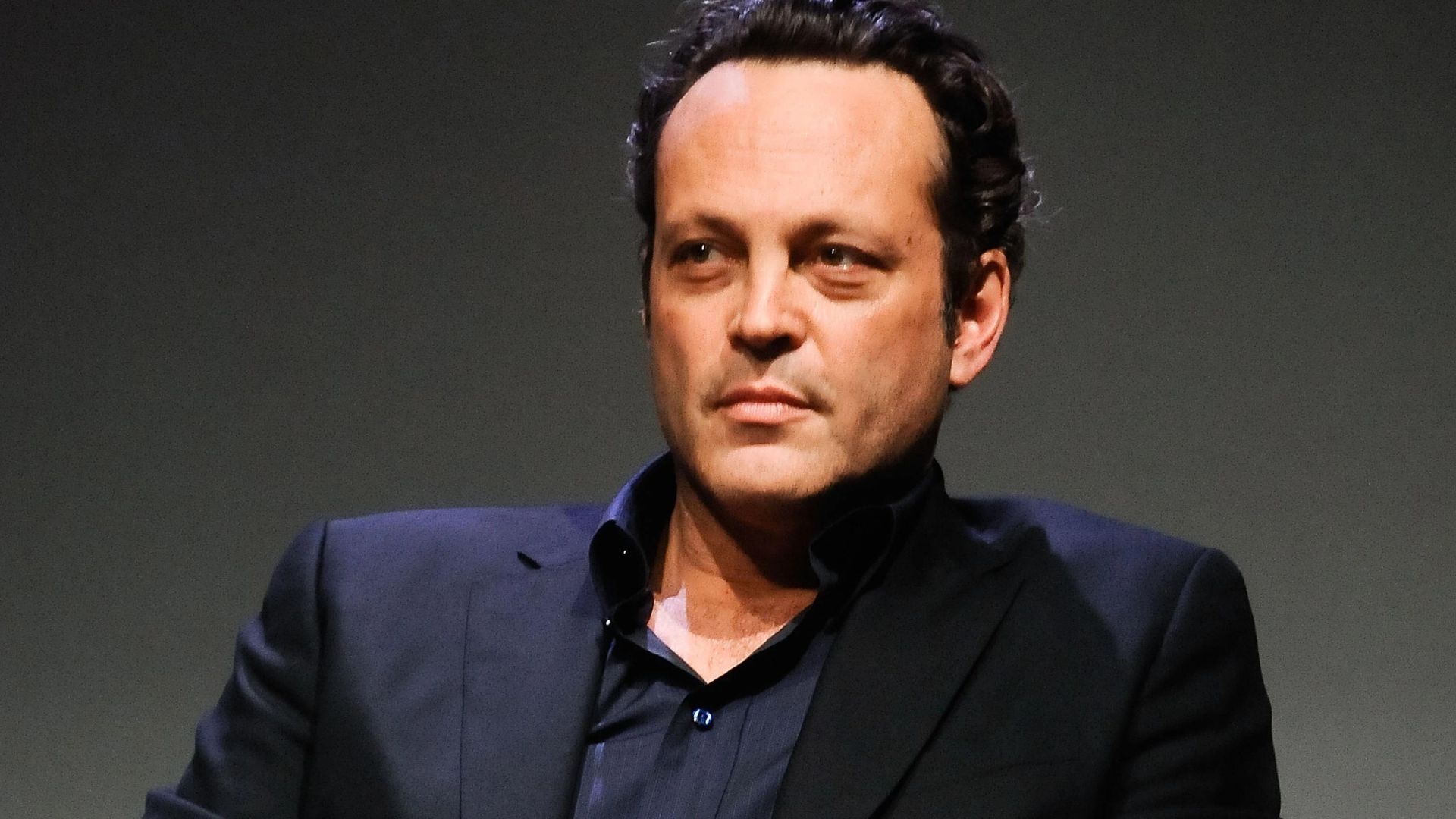 Vince Vaughn Sitting And Wearing Black Suit
