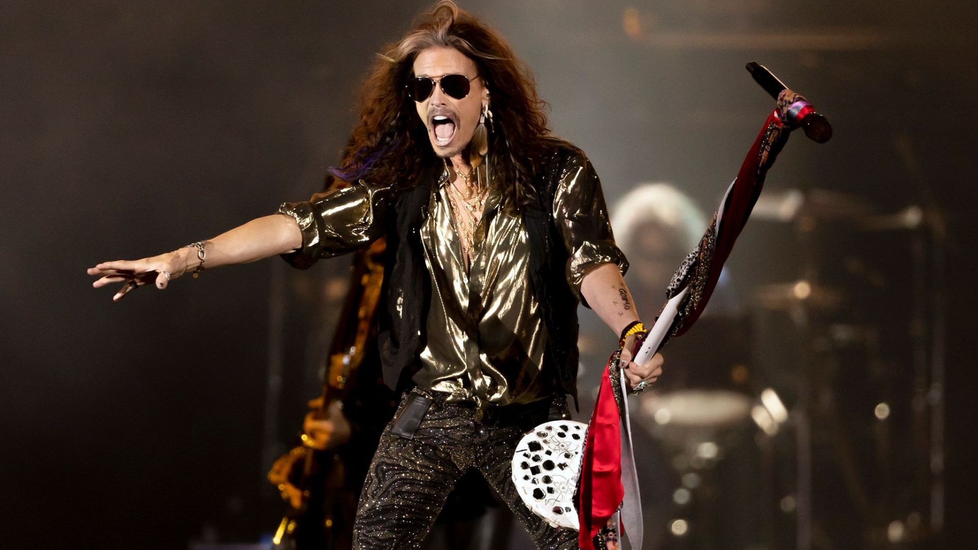Steven Tyler Performing On A Stage