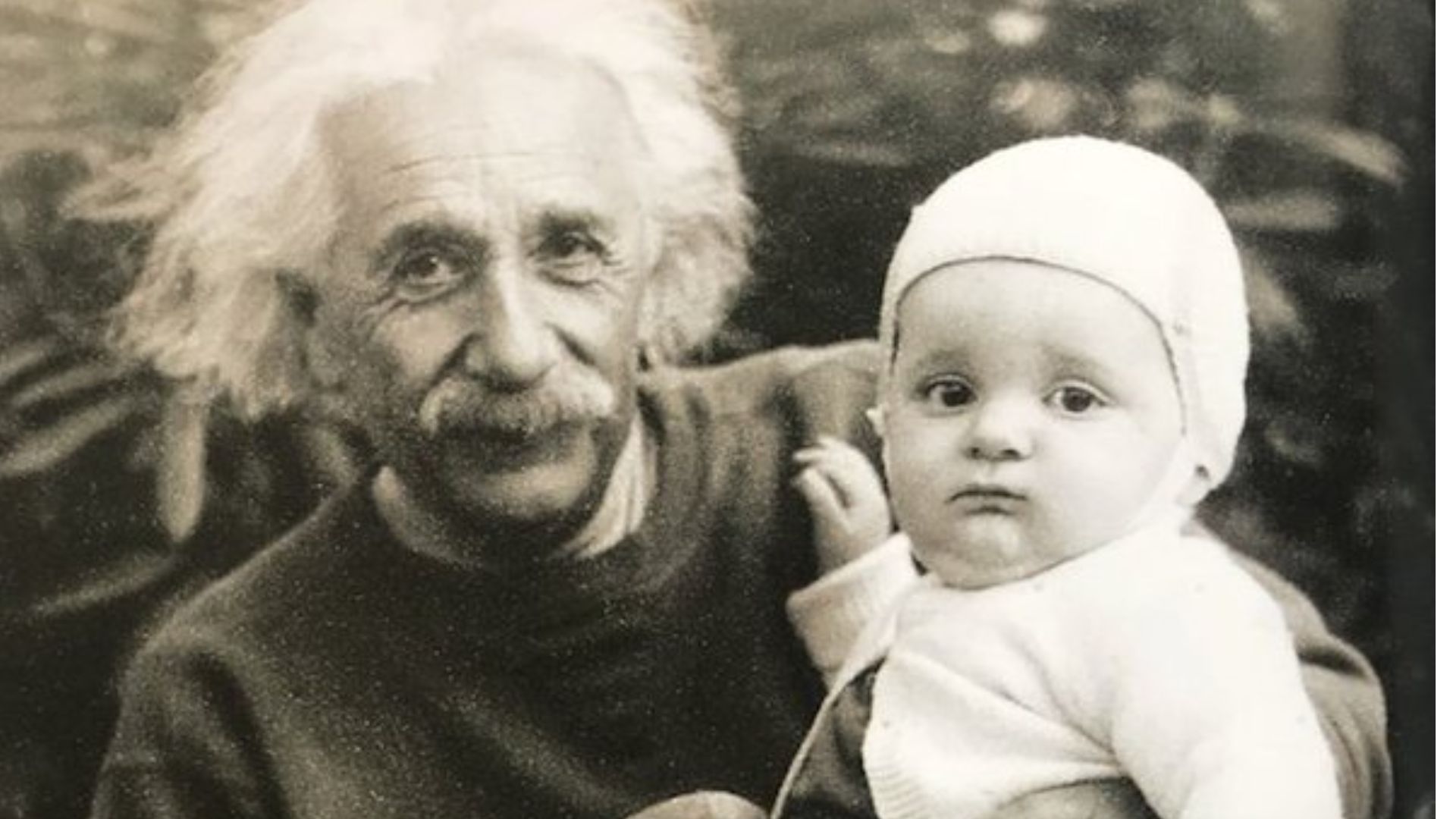 Albert Einstein Holding A Baby