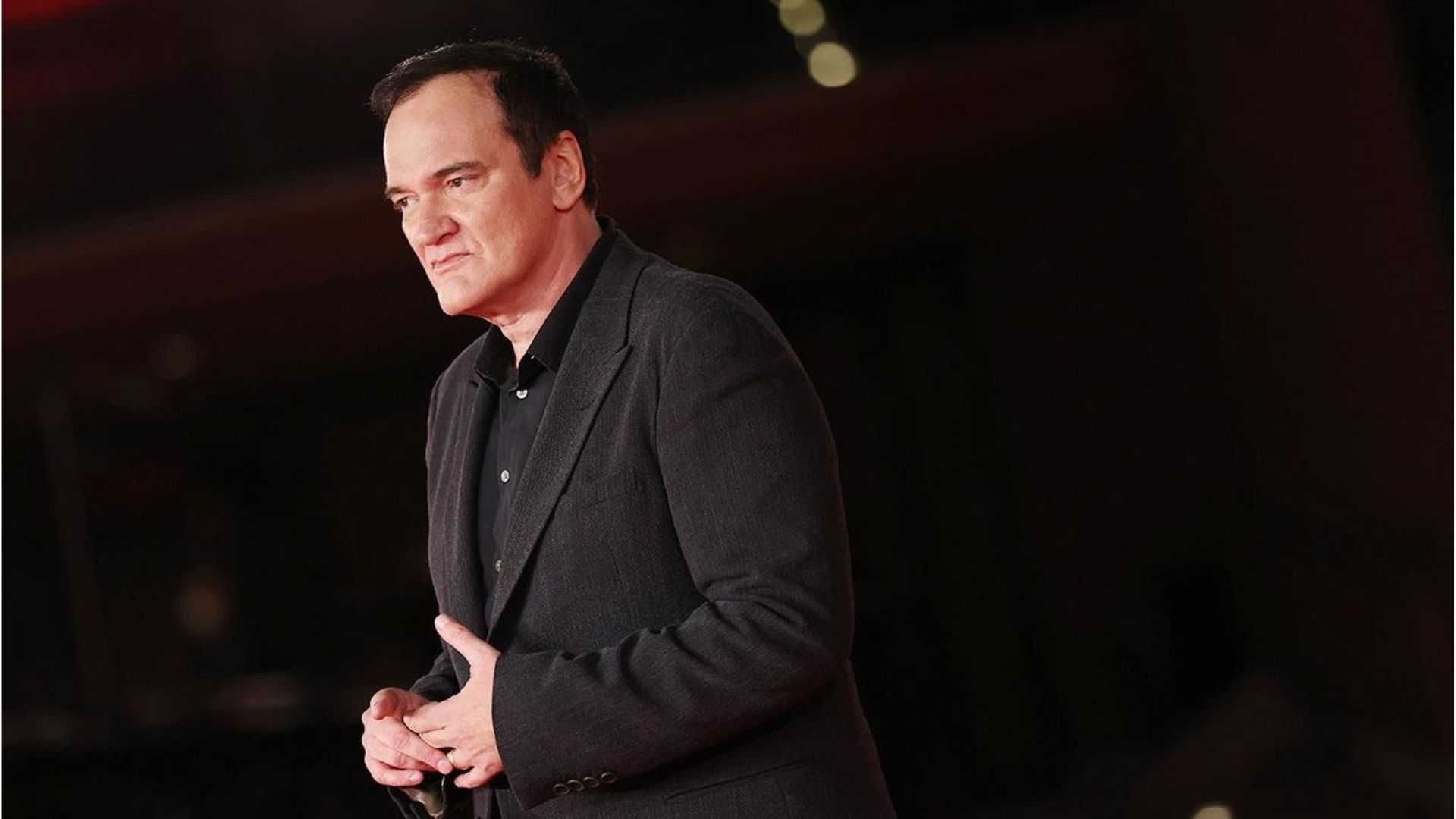 Quentin Tarantino Performing Wearing A Black Suit