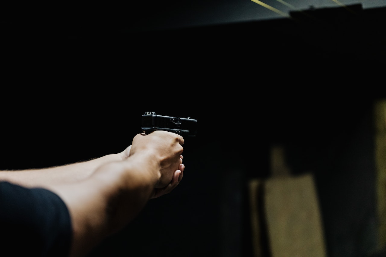 A Person Holding a Handgun