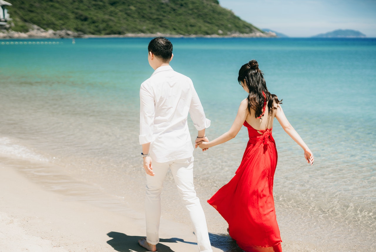 A Couple Walking on a Beach
