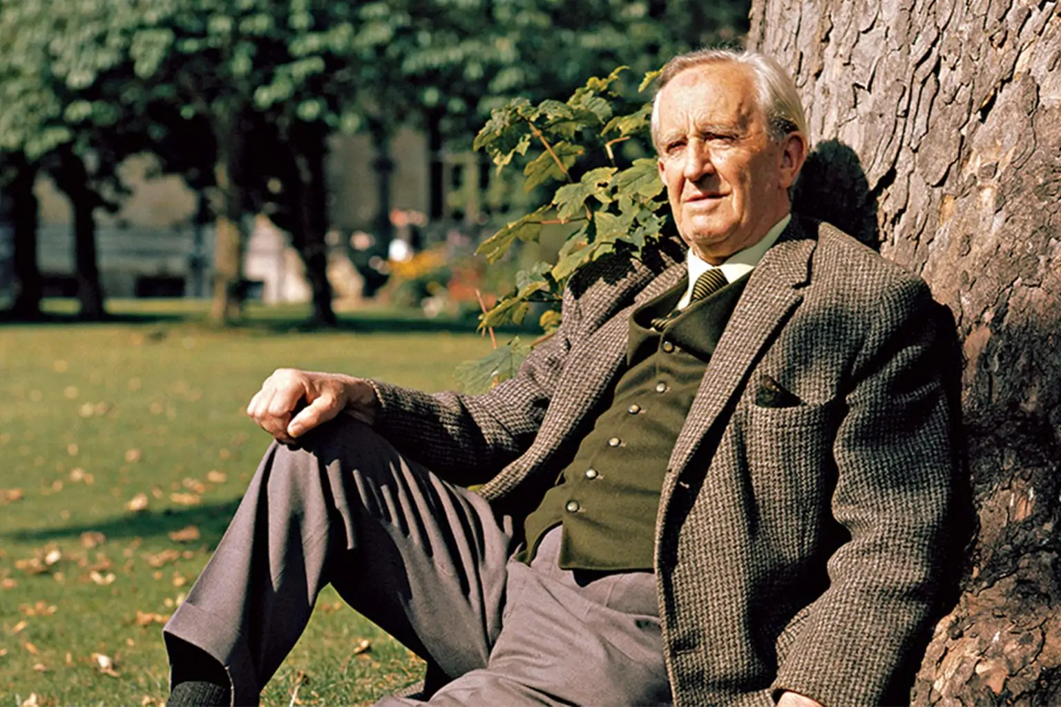J.R.R. Tolkien Sitting While Leaning On A Tree