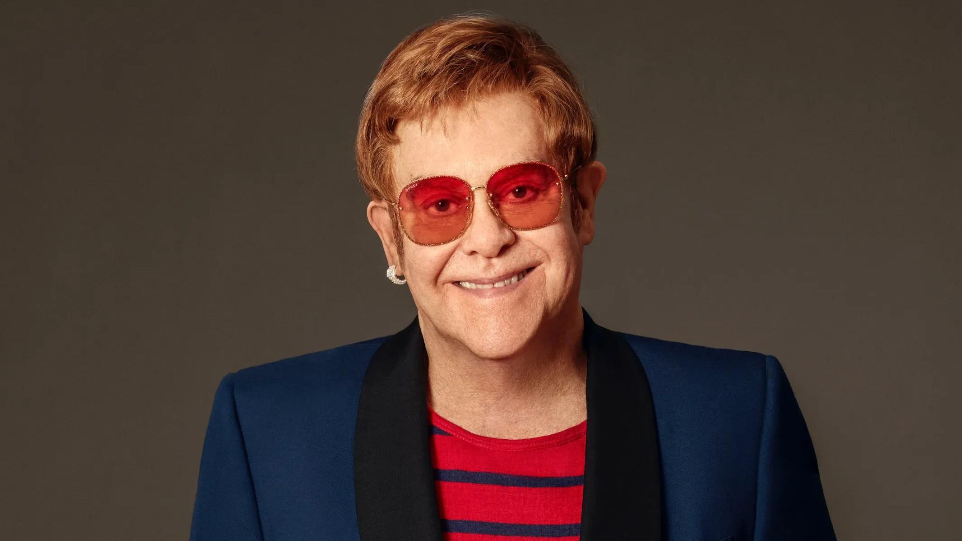 Elton John Wearing Blue Coat