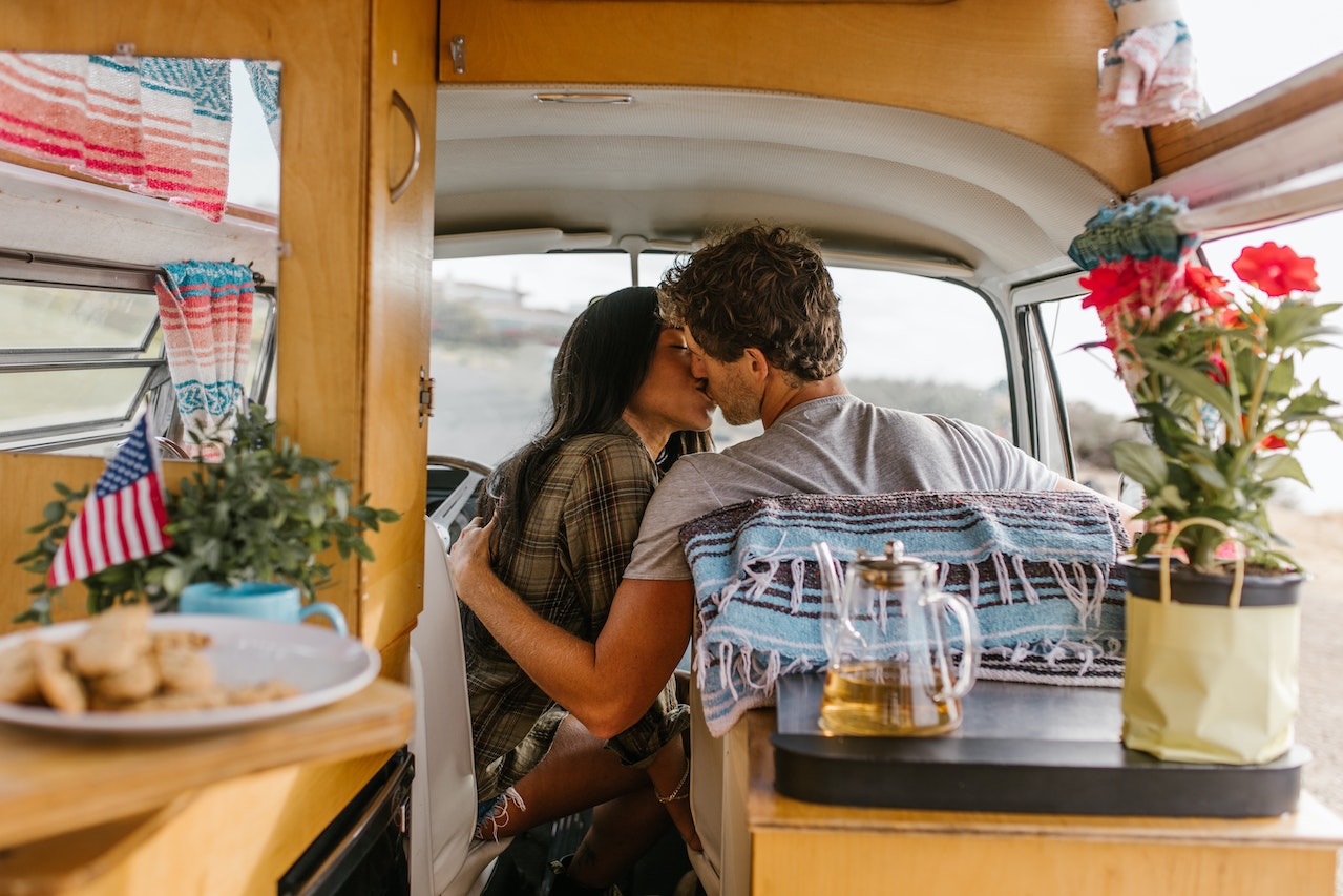 A Couple Kissing Inside the Van