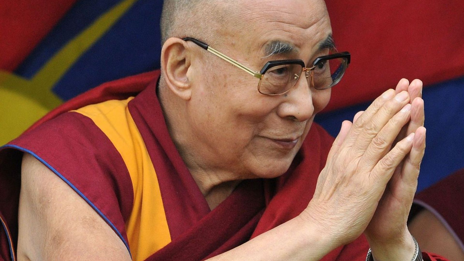 Dalai Lama Doing A Welcoming Gesture