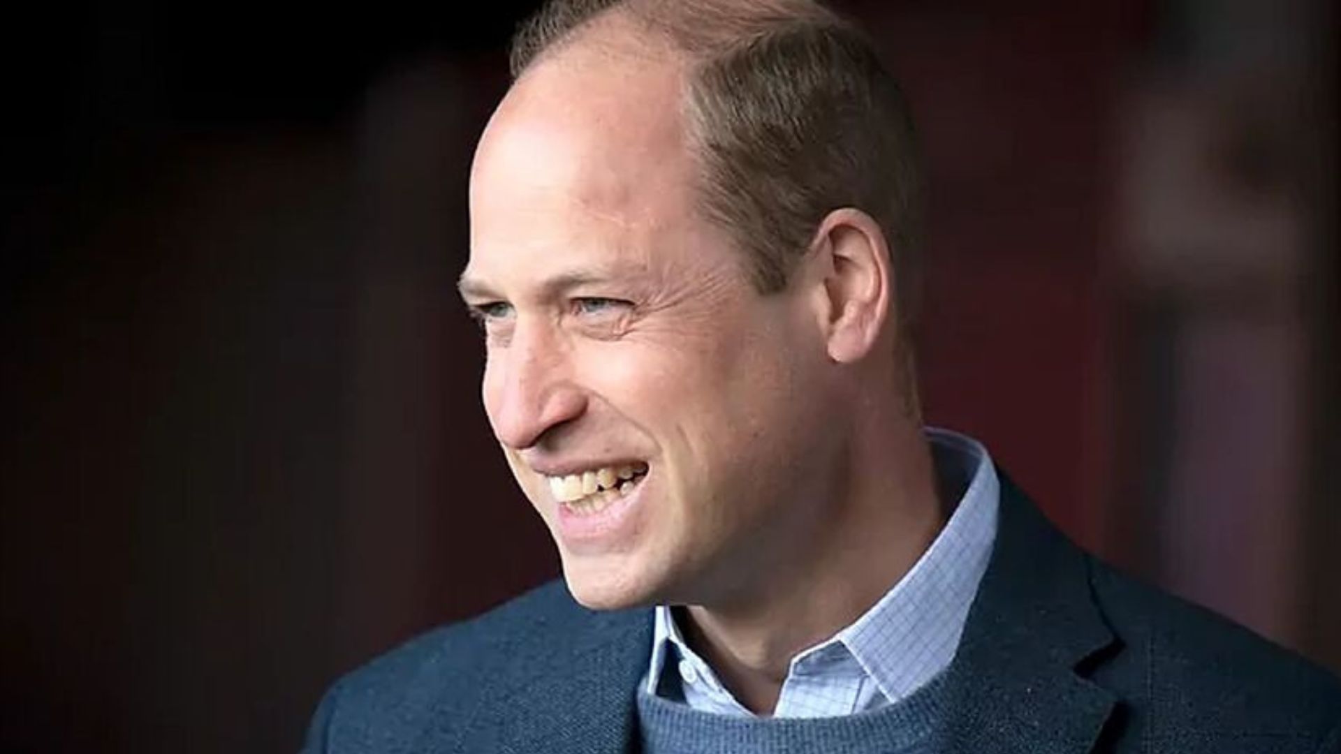 Prince William Smiling And Wearing Black Suit